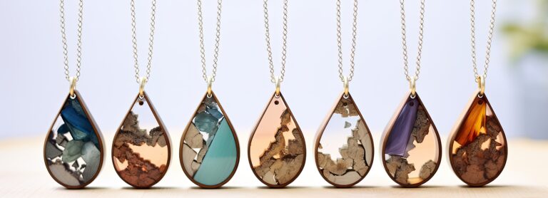 Three necklaces with different designs of wood and metal.