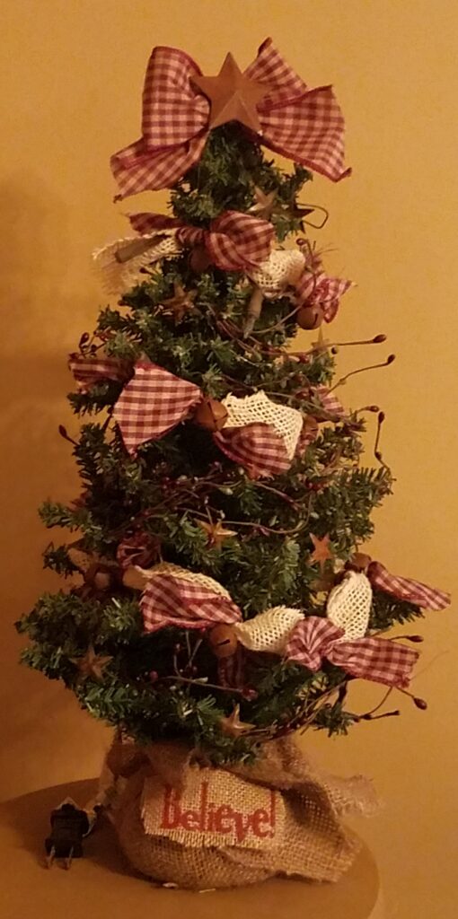 A christmas tree with red and white decorations.