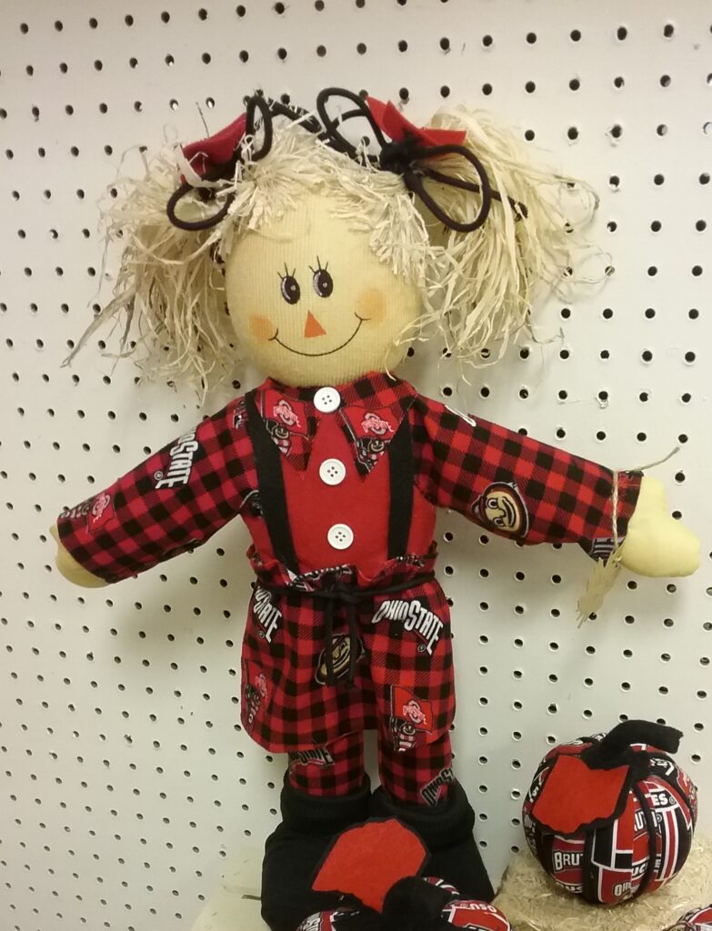 A doll is hanging on the wall