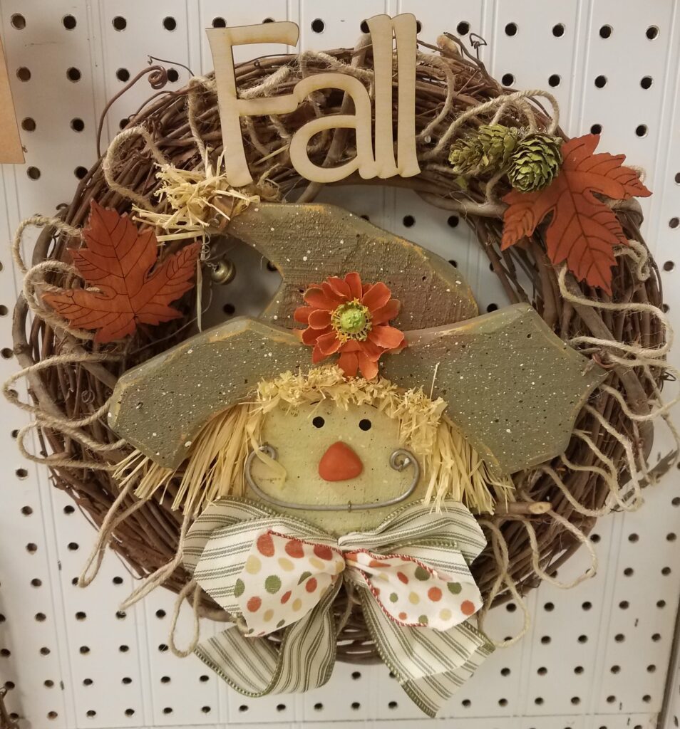 A wreath with a scarecrow on it.