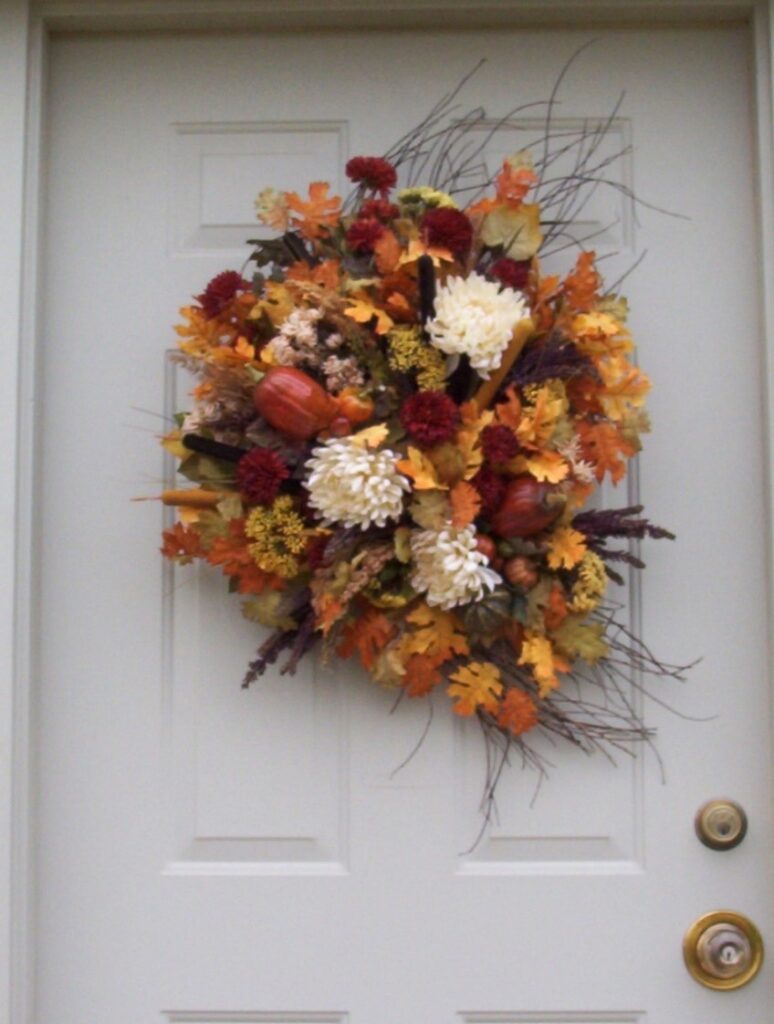 A wreath of flowers hanging on the door.