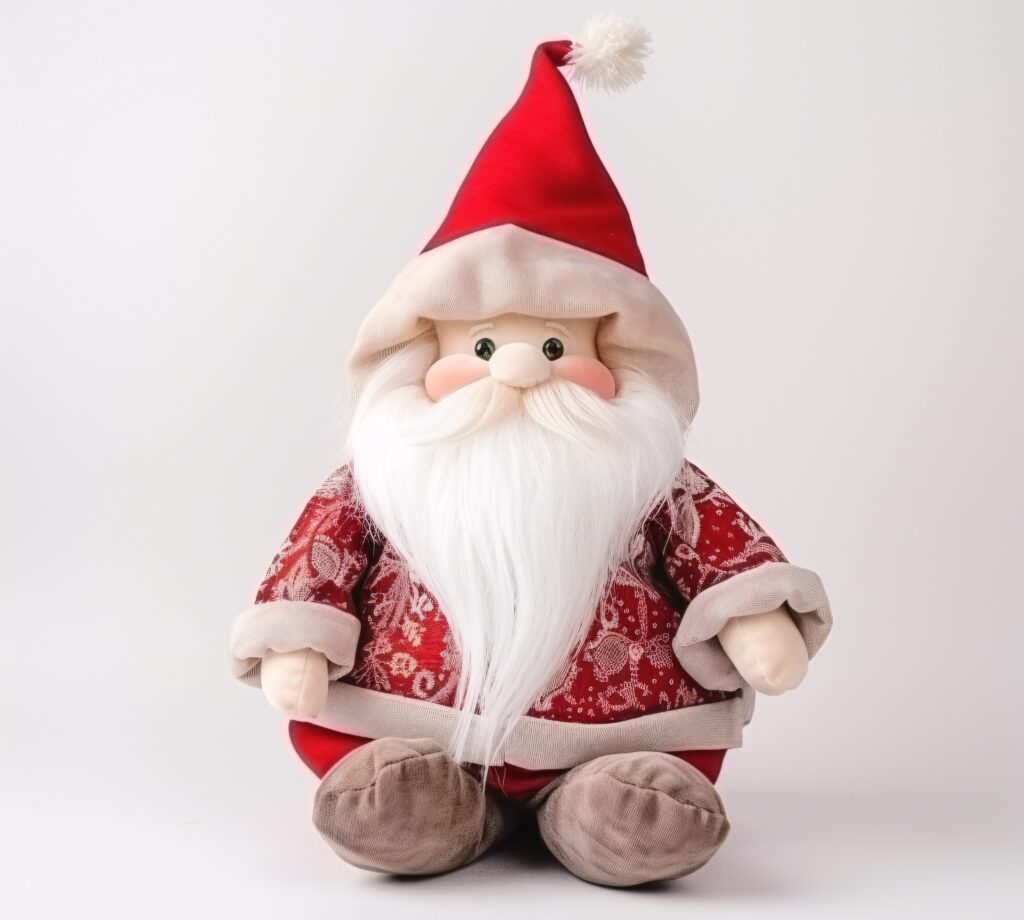 A stuffed santa claus sitting on top of a white table.