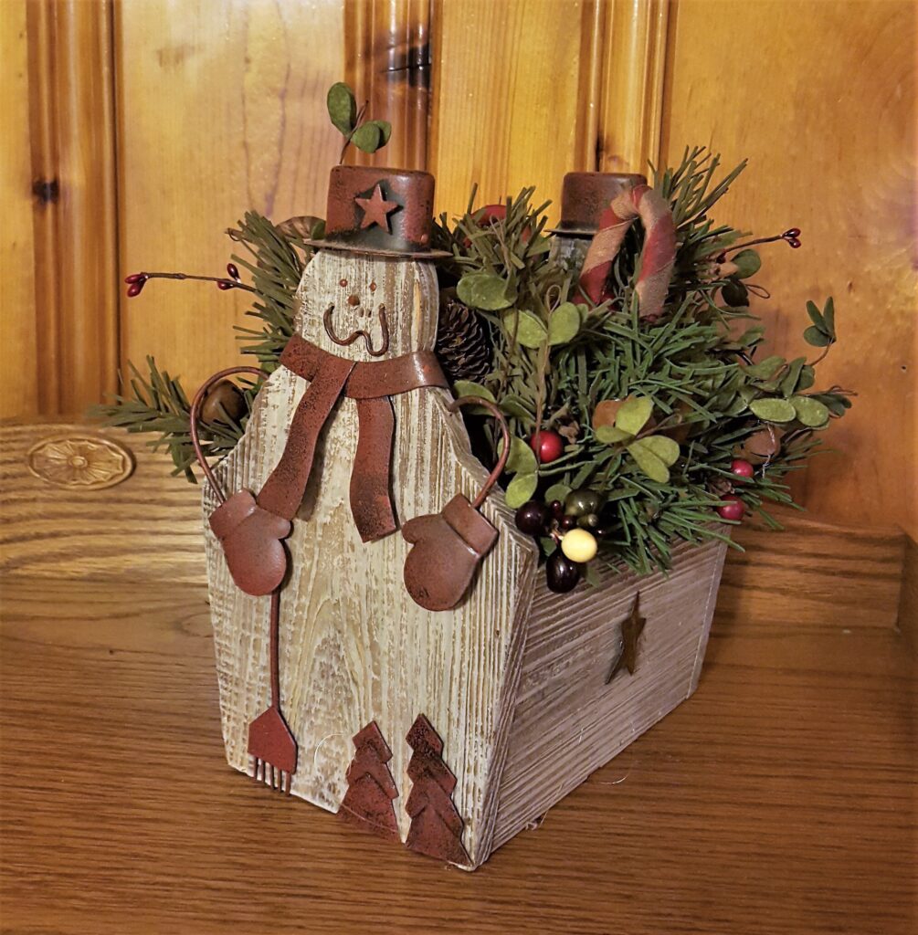 A wooden box with some flowers in it