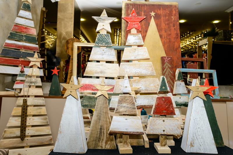 A group of wooden trees with star decorations.