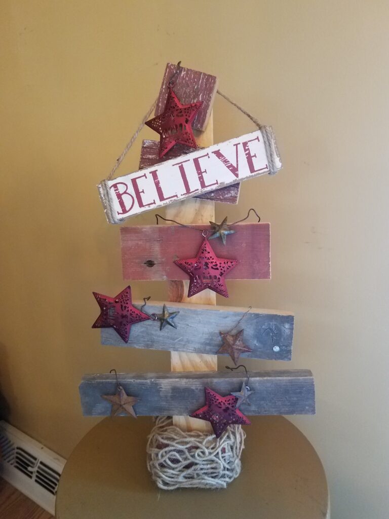 Rustic wood Christmas tree; Believe.