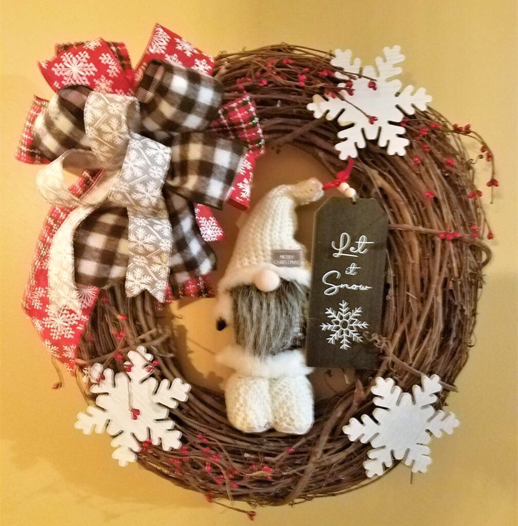 Here's an alt tag for the image: Christmas wreath with gnome and snowflakes.