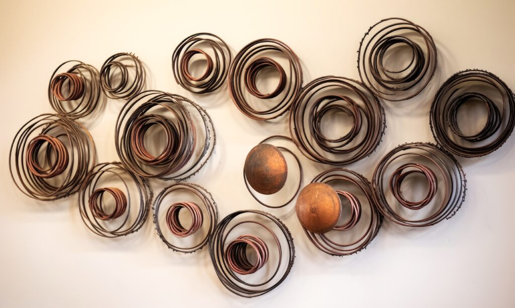 Metal coil wall art, abstract circles.