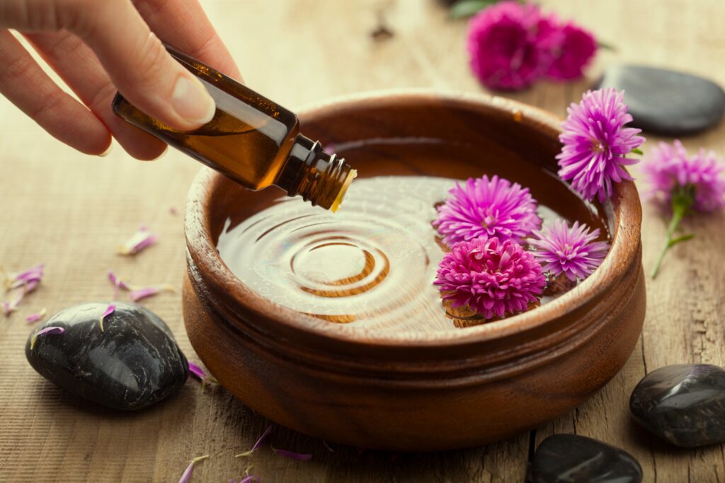 Essential oil added to water with flowers.