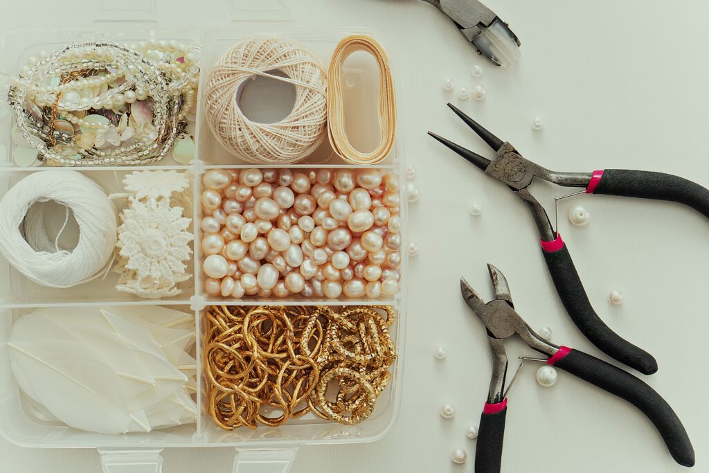 Jewelry making supplies in a box.