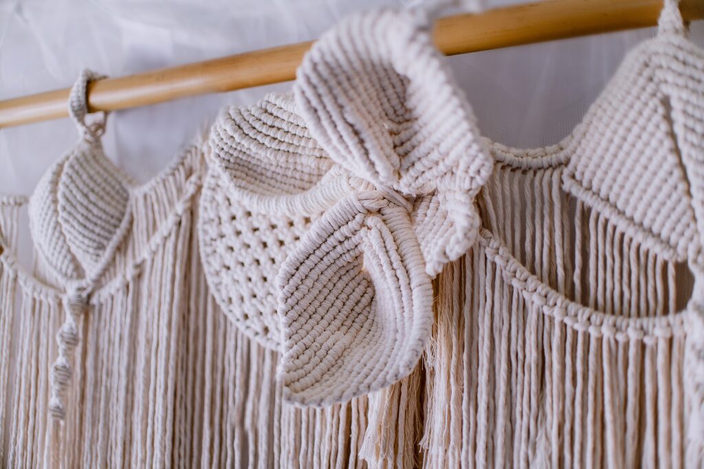 Beige macrame wall hanging decor.