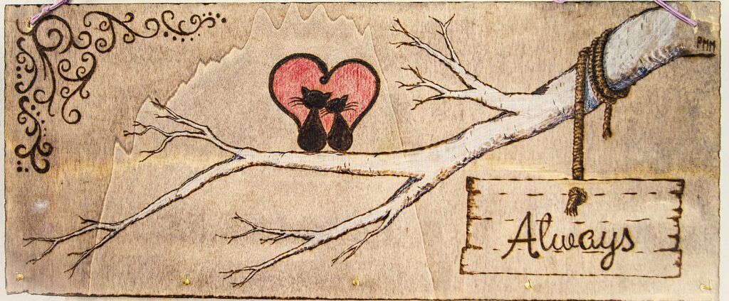 Wood burning art: Cats in heart, always.