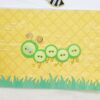 Cute button caterpillar on card.