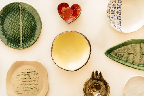 A table with different plates and bowls on it