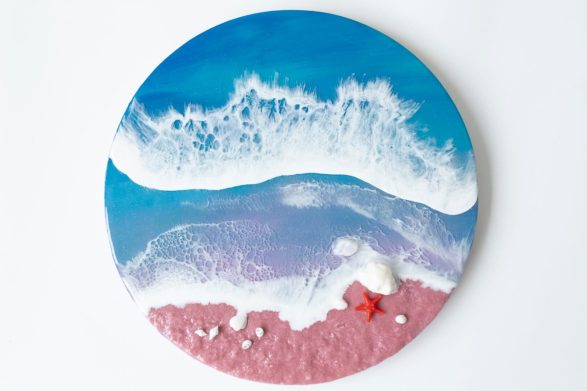 Ocean wave resin art with shells.